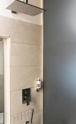 a bathroom with a sink and a mirror at Le Stanze di Elisa in Rome