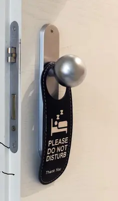 a door knob with a do not disturb sign on it at Le Stanze di Elisa in Rome