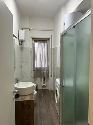 a bathroom with a sink and a toilet and a shower at San Pietro - Musei Vaticani Appartamento spazioso in Rome