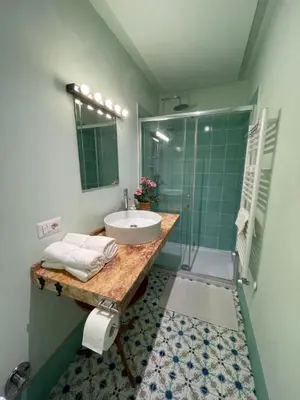 a bathroom with a sink and a shower at Lotto 21 della Garbatella in Rome