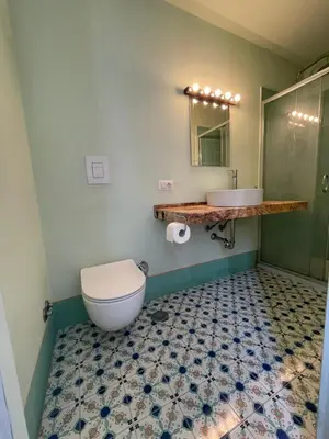 a bathroom with a toilet and a sink at Lotto 21 della Garbatella in Rome