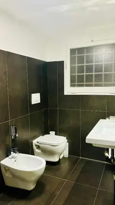 a bathroom with a toilet and a sink at Maison Pantheon & Breakfast in Rome
