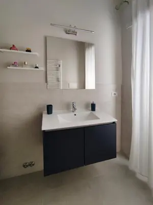 a bathroom with a sink and a mirror at Oasi Ridolfi in Rome
