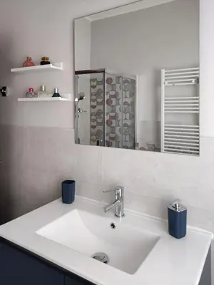a bathroom with a white sink and a mirror at Oasi Ridolfi in Rome