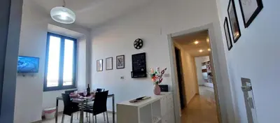 a room with a table and a dining room at Casa Linda in Rome