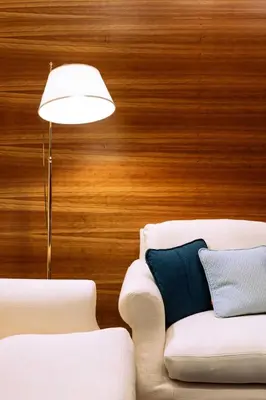 a living room with a couch and a lamp at Arancio Luxury Accomodation in Rome