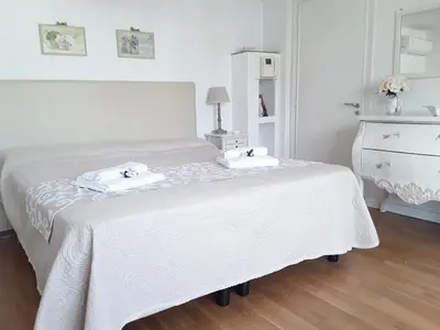 a bedroom with a white bed with towels on it at L'Attico di San Saba in Rome