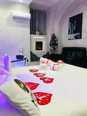a bedroom with a large white bed with a christmas blanket at Moya Suites 2 - SPA in Camera in Rome