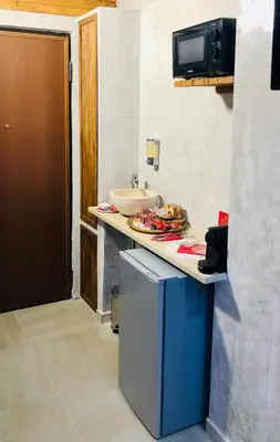 a kitchen with a counter with some food on it at Moya Suites 2 - SPA in Camera in Rome