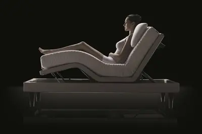 a man sitting in a chair with his legs crossed at Augusta Lucilla Palace in Rome
