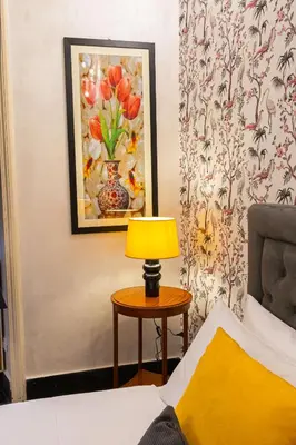 a bedroom with a bed and a table with a lamp at Sweet Navona Duplex Apartment in Rome