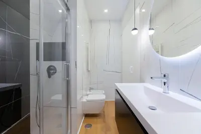 a bathroom with a shower and a toilet and a sink at Caesar Boutique Apartment in Rome