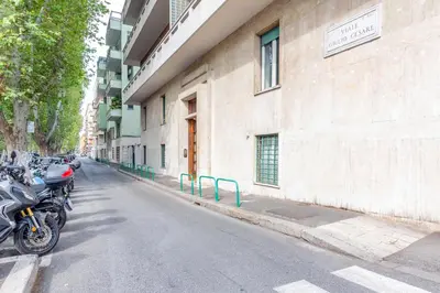 a row of motorcycles parked on the side of a building at Caesar Boutique Apartment in Rome
