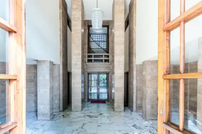 an empty hallway in a building with columns at Caesar Boutique Apartment in Rome