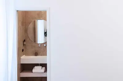 a bathroom with a sink and a mirror at Bonsignore Luxury Accomodation in Rome
