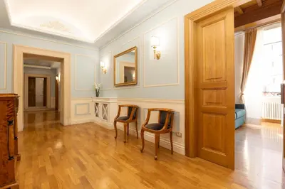 a living room with two chairs and a table at Pantheon Suites in Rome in Rome