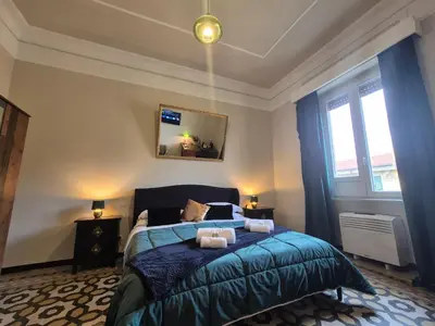 a bedroom with a bed with two towels on it at HEBE Eternity Rooms in Rome