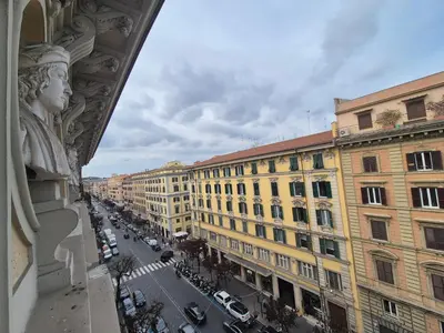 a view of a city street with buildings and a statue at HEBE Eternity Rooms in Rome