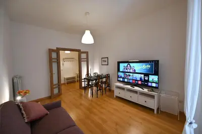 a living room with a couch and a flat screen tv at Dodo House in Rome