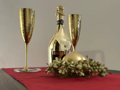 a bottle of wine and two champagne glasses on a table at Dodo House in Rome