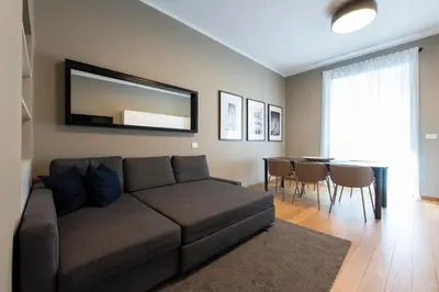 a living room with a couch and a table at Vatican Scipioni Apartment in Rome
