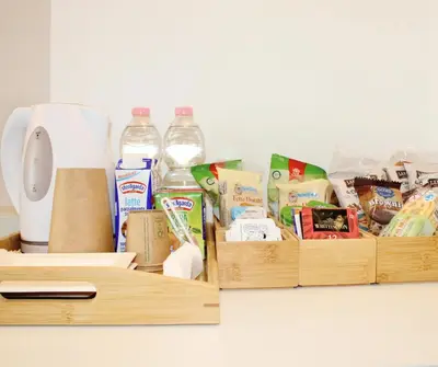 a kitchen counter with two wooden containers filled with food at Mama House 2 - Trastevere in Rome