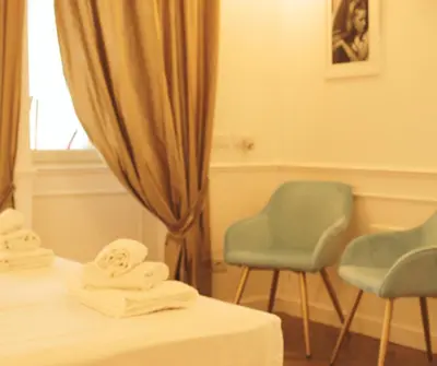 a room with two chairs and a bed and a window at Mama House 2 - Trastevere in Rome
