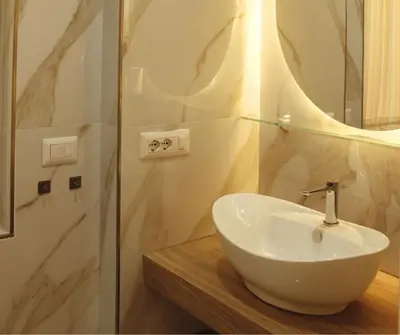 a bathroom with a sink and a glass shower at Mama House 2 - Trastevere in Rome