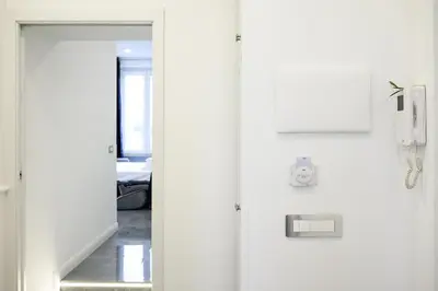 a door leading to a room with a hallway at Domus Enrico in Rome