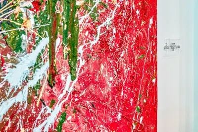 a red painting of trees on a wall at Skylife Art Gallery Loft - Riverfront Art Sanctuary in Rome