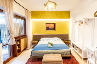 a bedroom with a bed with a stuffed animal on it at Olive Whisper Rome Garden and Sauna in Rome