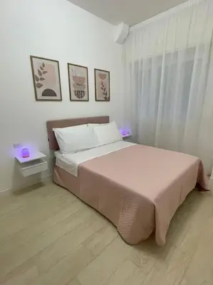 a bedroom with a large bed and a window at Vatican Apartment - Betty Home in Rome