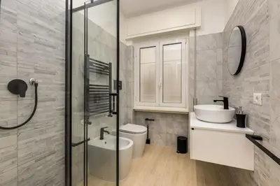 a bathroom with a shower and a toilet and a sink at Vatican Apartment - Betty Home in Rome