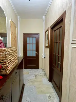 a bathroom with a door and a counter and a hallway at Barbi's Home- Colli Albani Roma in Rome