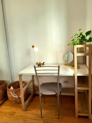 a desk with a chair and a table with a mirror at Sky Hub21 in Rome