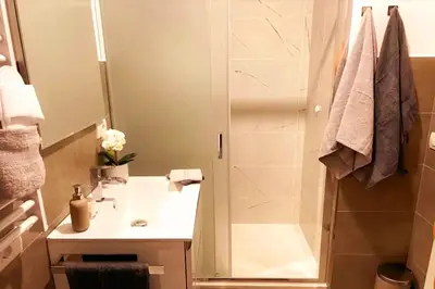 a bathroom with a shower and a white sink at Sky Hub21 in Rome