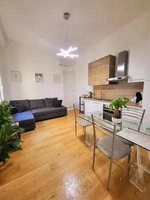 a living room with a couch and a table at Sky Hub21 in Rome