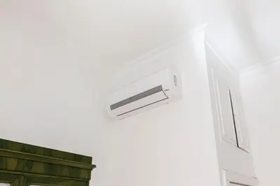 a bathroom with a air conditioner on the wall at Spanish Steps Historic Apartment in Rome