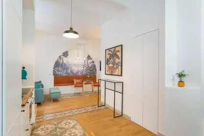 a hallway with white walls and a dining room at 15 minutes to Colosseum - Loft with terrace in Rome