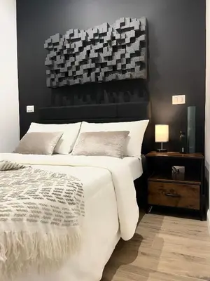 a bedroom with a large bed and a window at Scipioni Relais in Rome
