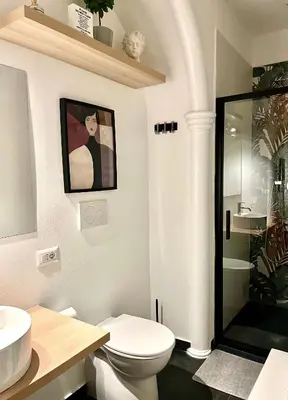 a bedroom with a large bed and a couch at Scipioni Relais in Rome