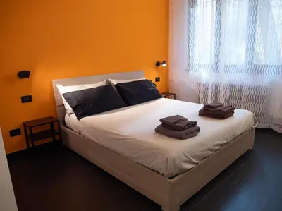 a bedroom with a bed with two towels on it at Conca D'oro Colors - Metro & WI-FI in Rome