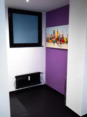 a room with a purple and white wall at Conca D'oro Colors - Metro & WI-FI in Rome