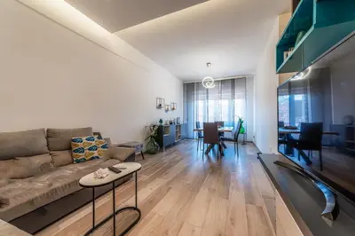 a living room with a couch and a table at Giorgia Flat - Tiburtina Train Station - Wi-Fi in Rome