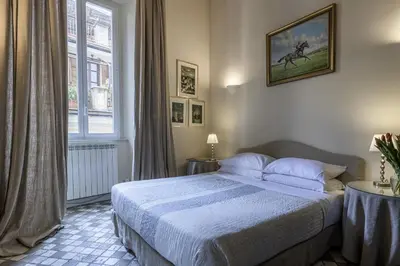 a bedroom with a bed and a window at Piazza della Maddalena view in Rome