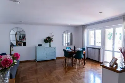 a living room with a table and a dining room at Vatican Luisa in Rome