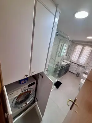 a small bathroom with a washing machine in a room at Vatican Luisa in Rome