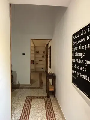 a hallway with a sign on the wall at Valentina Suite Colosseo in Rome