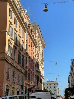 a row of buildings on a city street at Valentina Suite Colosseo in Rome
