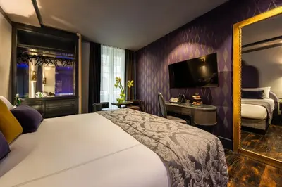 a bedroom with a large bed and a window at HT6 Hotel Roma in Rome